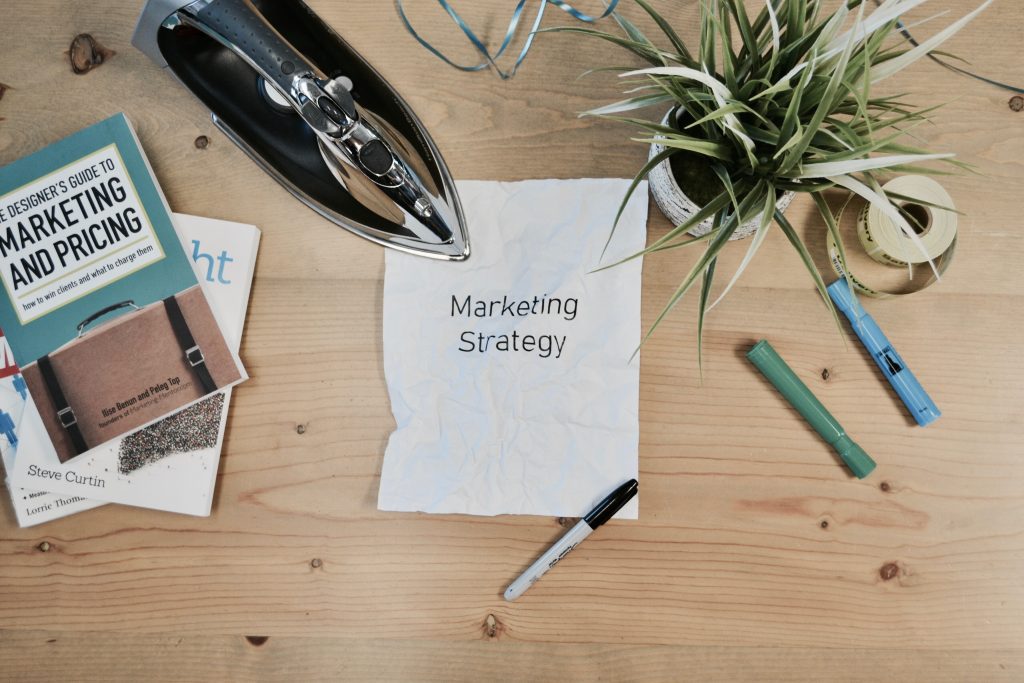 Keene Marketing Agency A note with the words "marketing strategy" sits on a wooden table in Keene, New Hampshire.