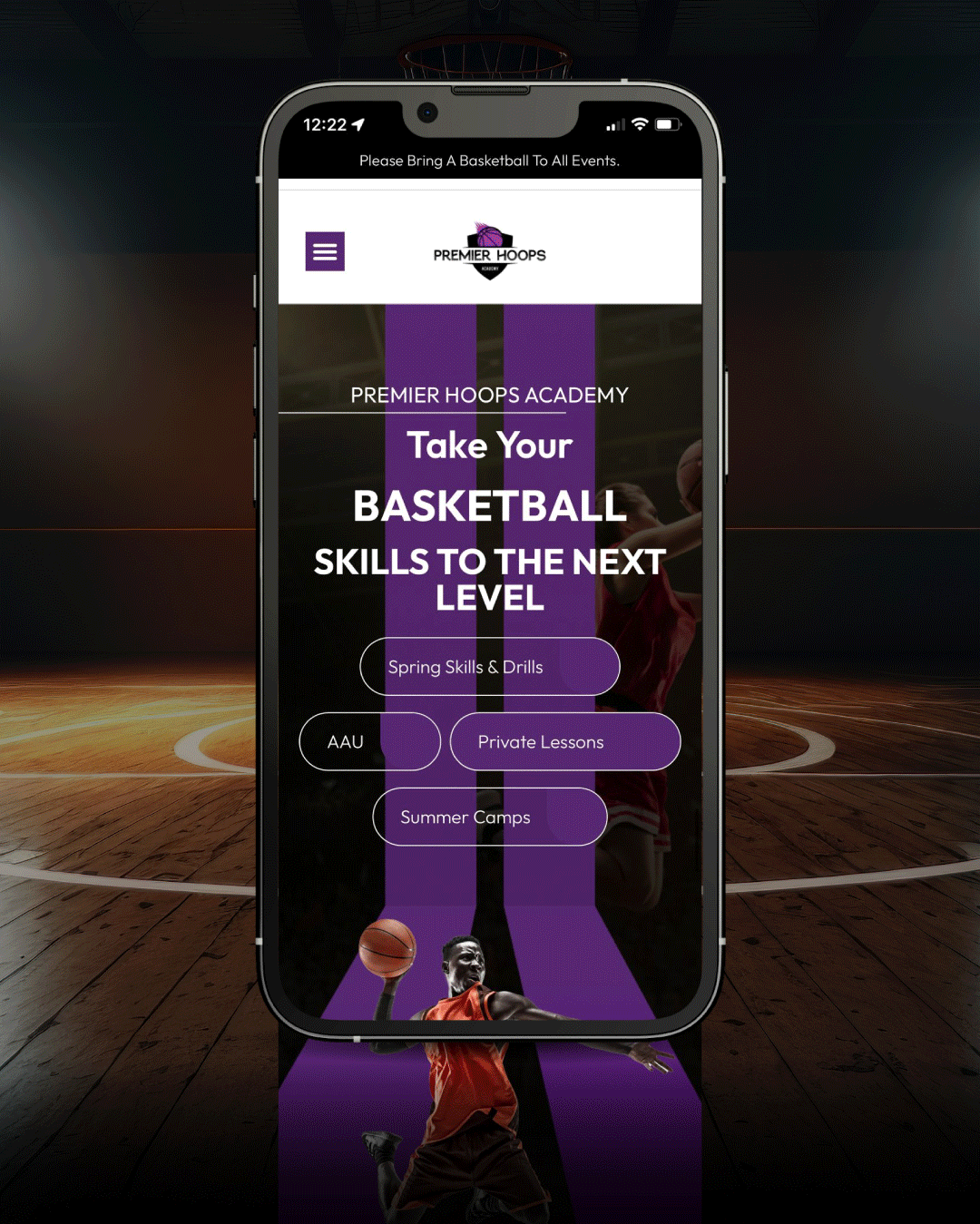 Keene Marketing Agency A smartphone displays the Premier Hoops Academy website offering basketball skills training, AAU programs, private lessons, and summer camps against a basketball court background.