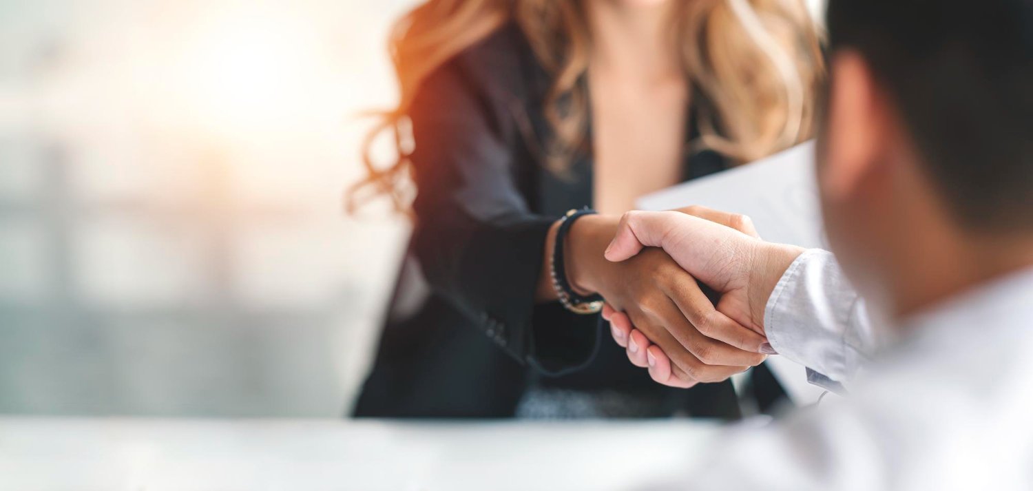 New Hampshire Two people are shaking hands in a professional setting, with one person facing the camera and the other partially out of frame. This could be an important deal for HVAC companies looking to leverage digital marketing trends. Marketing Agency