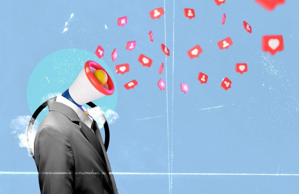 New Hampshire A headless person in a suit has a megaphone for a head, emitting social media notification icons against a blue background, symbolizing the dynamic power of franchise marketing strategy. Marketing Agency