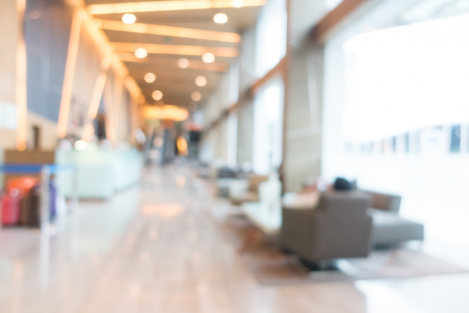 New Hampshire A modern, bright airport lounge with seating areas and large windows, designed to measure customer satisfaction. The scene is slightly blurred. Marketing Agency