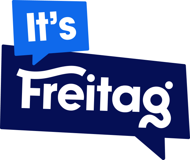 New Hampshire Logo with "It’s Freitag" in white text on dark blue and blue speech bubbles. Marketing Agency