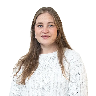 New Hampshire Woman with long brown hair wearing a white knit sweater, standing against a plain white background, looking at the camera with a neutral expression. Marketing Agency