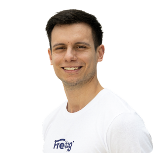 New Hampshire A man with short dark hair smiles, wearing a white T-shirt with "Freitag" written on it, standing against a plain white background. Marketing Agency