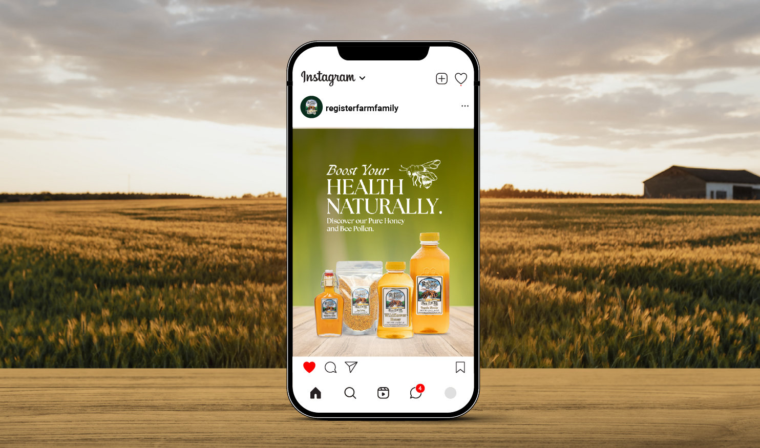 New Hampshire A smartphone displays an Instagram post with various honey and bee pollen products on a wooden table, against a green background with the text “Boost Your Health Naturally.”. Marketing Agency