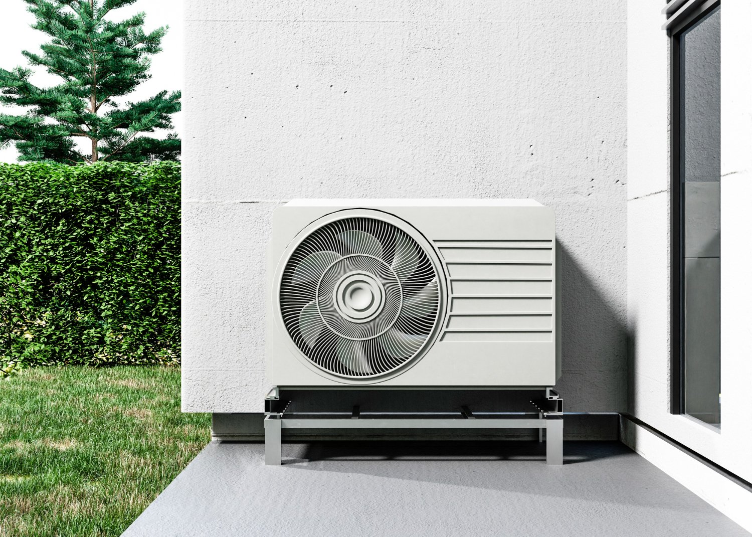New Hampshire A large outdoor air conditioning unit is mounted on a metal stand next to a building, with grass, a hedge, and a tree visible in the background. Marketing Agency