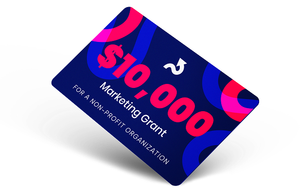 New Hampshire A blue card with bold text reads "$10,000 Marketing Grant for a Non-Profit Organization" on a geometric background with pink and blue shapes. Marketing Agency