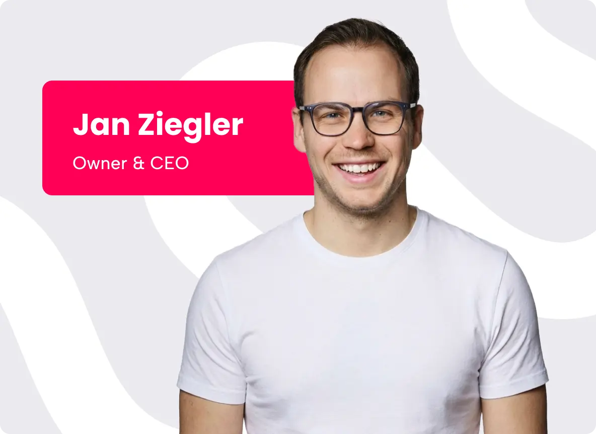 New Hampshire A man wearing glasses and a plain white t-shirt smiles at the camera. A label on the left reads "Jan Ziegler, Owner & CEO" on a red background. Marketing Agency
